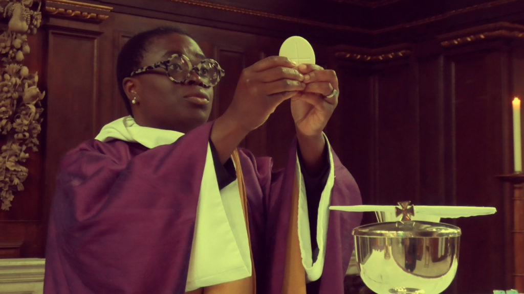 female priest celebrating the Eucharist