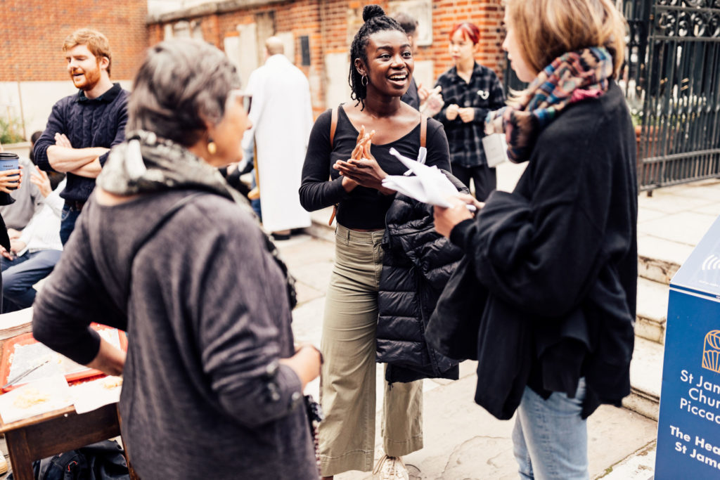 Group of people talking in courtyard
