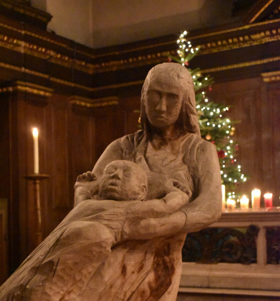 Wooden carved sculture of Mary and the baby jesus